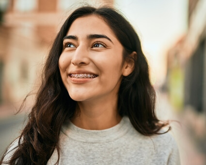 Smiling woman with braces