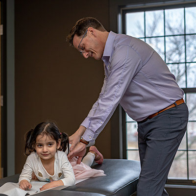 Adjusting girl on table