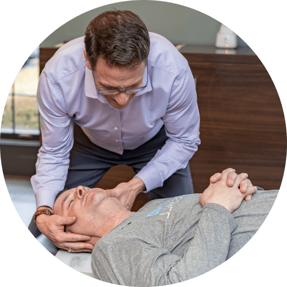 Doctor adjusting patient