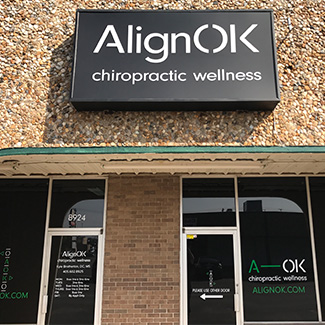 AlignOK Chiropractic Wellness Sign on Outside of building
