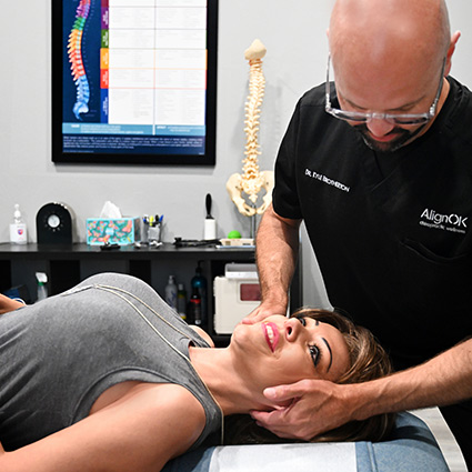 Adjusting woman's neck