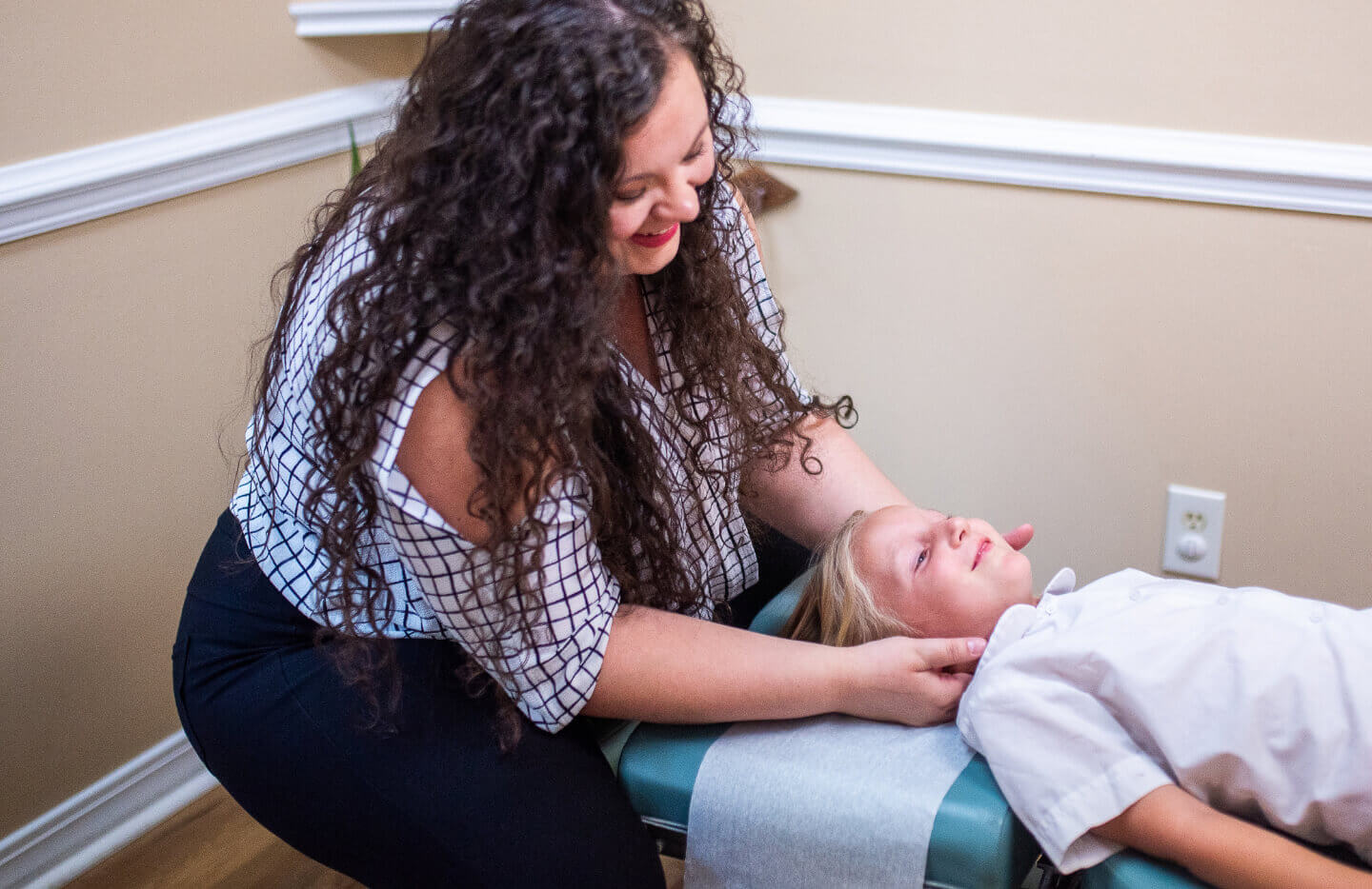 Healing Touch Chiropractic chiropractor adjusting toddler