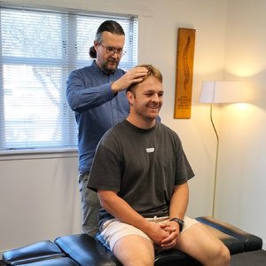 Dr-Kane-adjusting-male-patient
