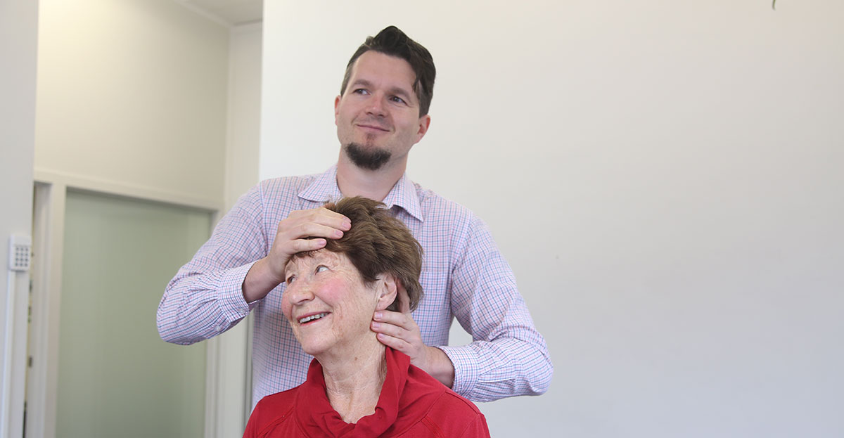 Woman getting neck adjustment