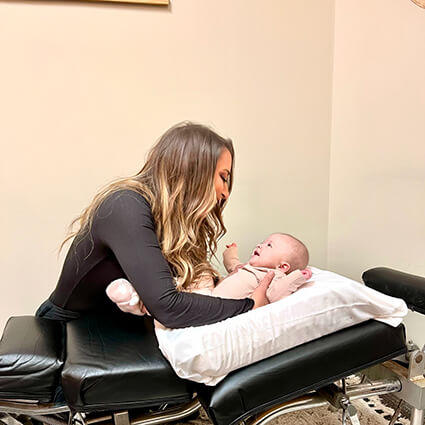 Dr-Kristin-adjusting-baby-girl