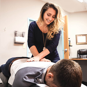 Doctor adjusting patient