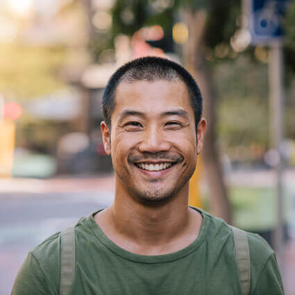 happy-male-face-outdoors-sq