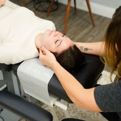 Adjusting woman's head