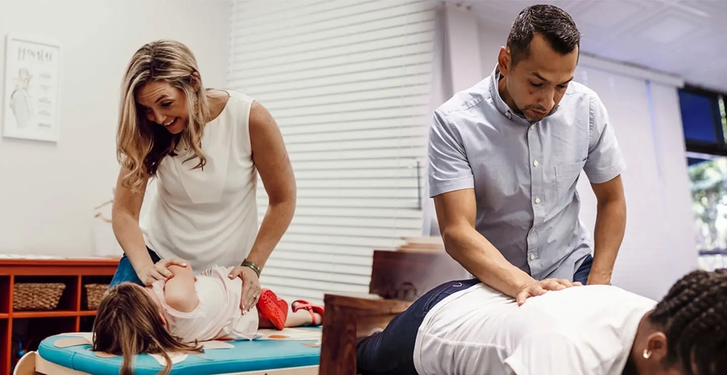 two doctors adjusting patients