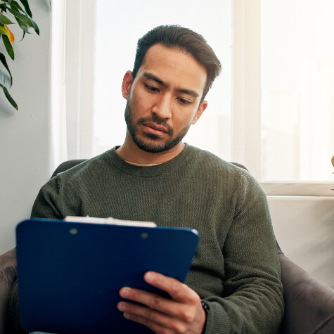 Male patient completing paperwork