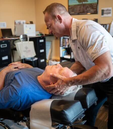 Man having his neck adjusted