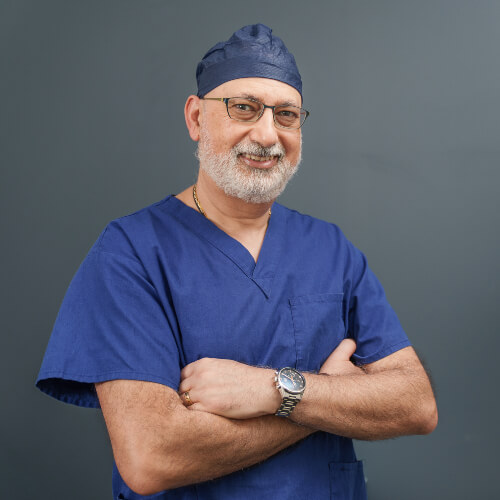Dr Aziz arms folded