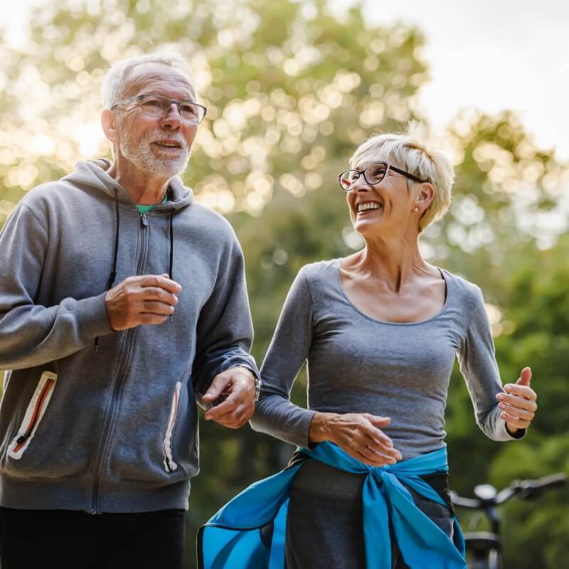 man and woman walking outdoors