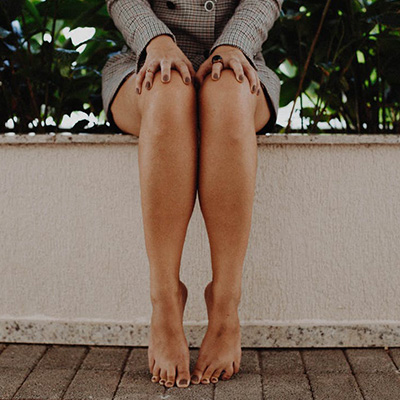 woman sitting on ledge