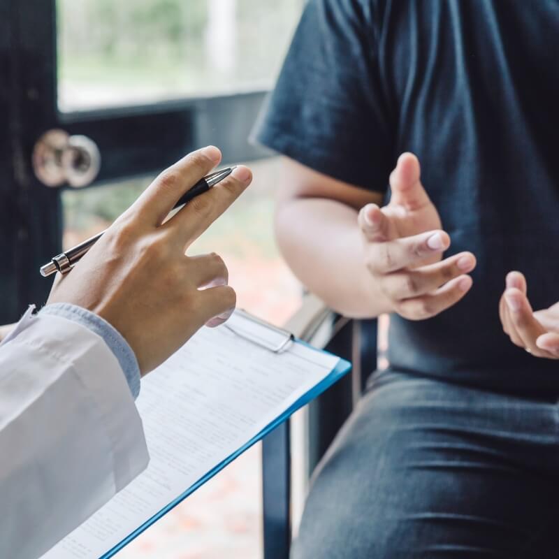 person talking with a doctor