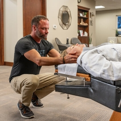 Dr Matt adjusting patients neck