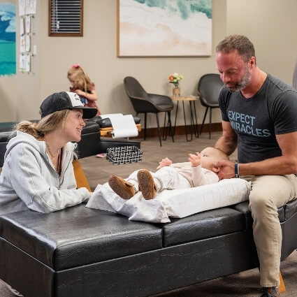 Dr Matt adjusting baby