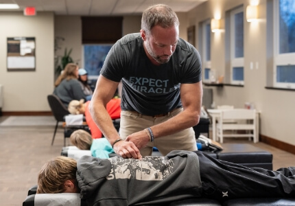 Dr Matt adjusting kids back
