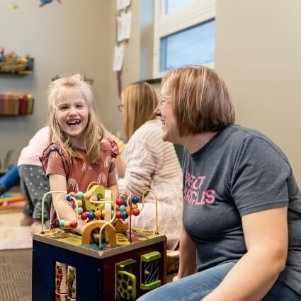kid and mom smiling