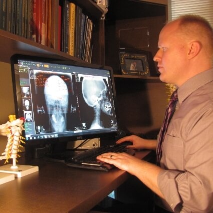 Dr Hogue reviewing patient xrays
