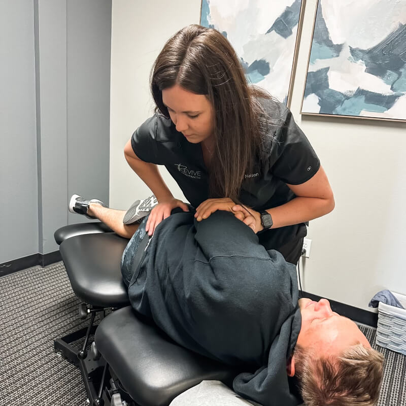 Grand Forks chiropractor Dr Nelson adjusting patients back