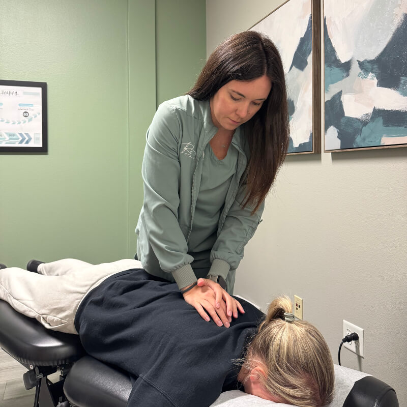 Grand Forks chiropractor Dr Nelson adjusting patients back