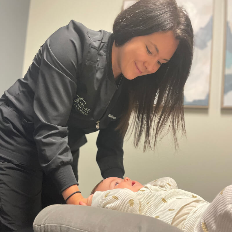 Grand Forks chiropractor Dr Nelson adjusting infant patient