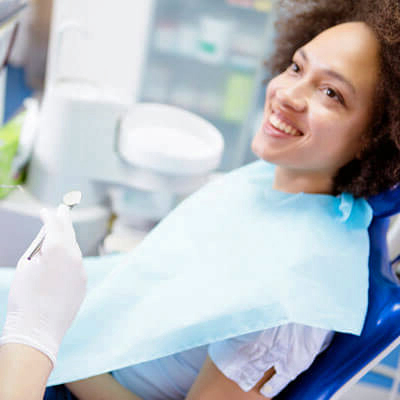 Happy, smiling woman in dentist chair
