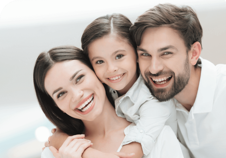 family of three smiling