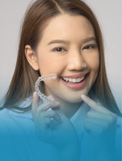 woman holding aligner