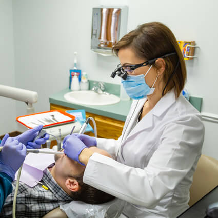 Dr Larashi of Hallmark Smiles Dental Care with patient