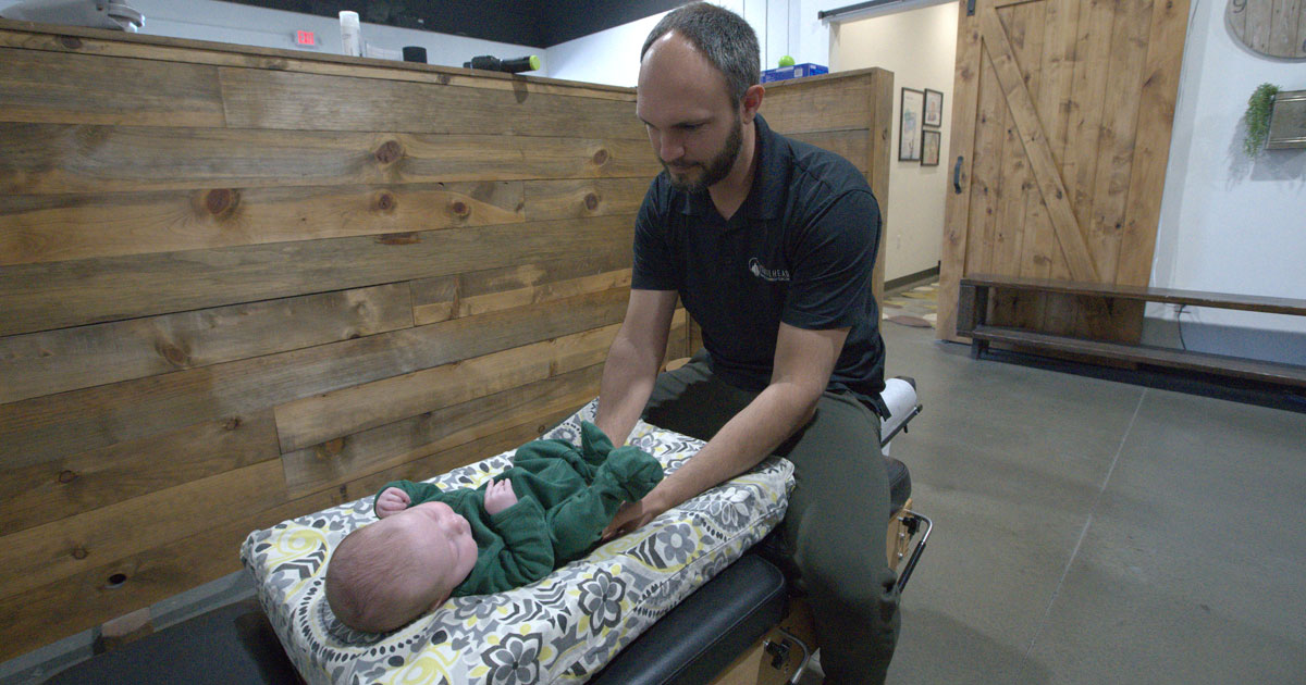 Doctor adjusting baby