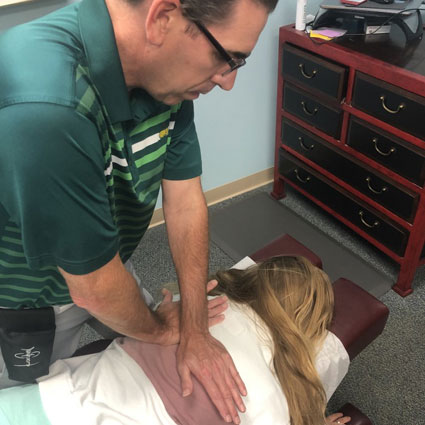 Dr. O'Donahue adjusting patient