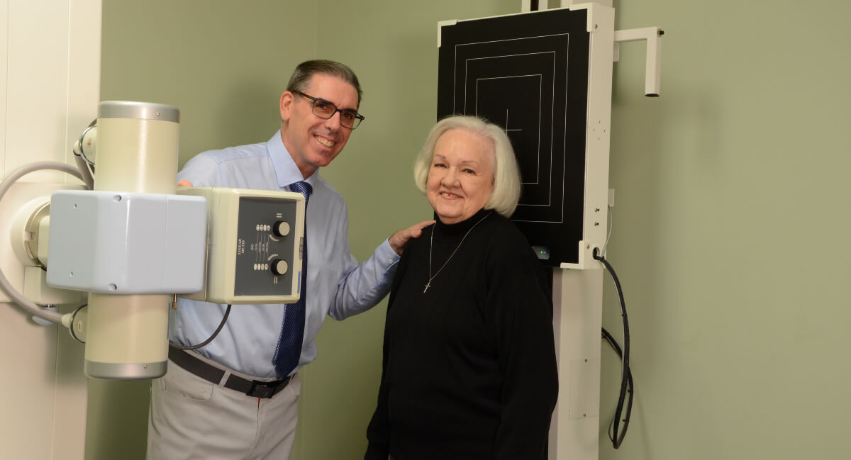 Greenville chiropractor posing for photo with patient