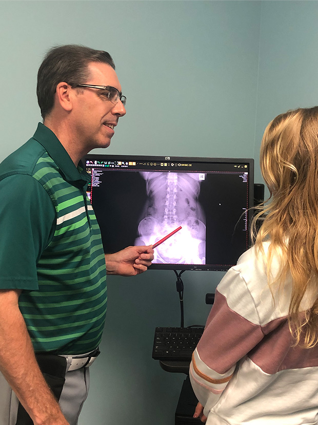 Dr O'Donahue showing x ray to patient