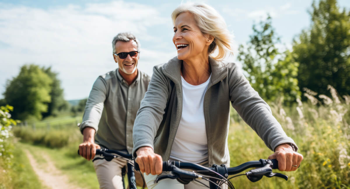 Two senior adults riding bicycles