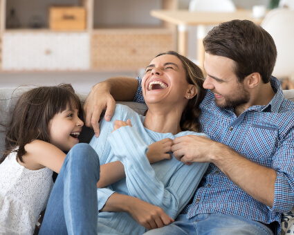 Smiling family of three
