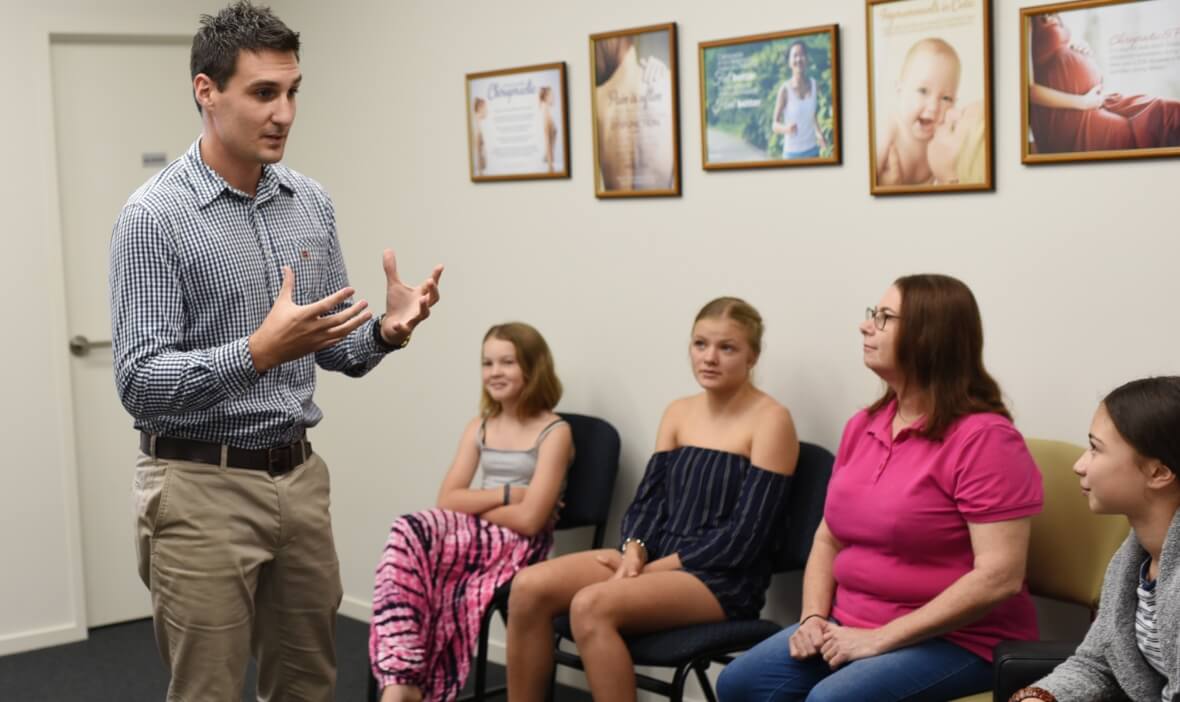 Dr Stott in discussion with a group of patients