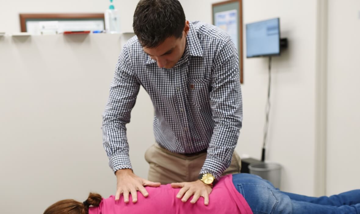 Ipswich patient receiving a back adjustment