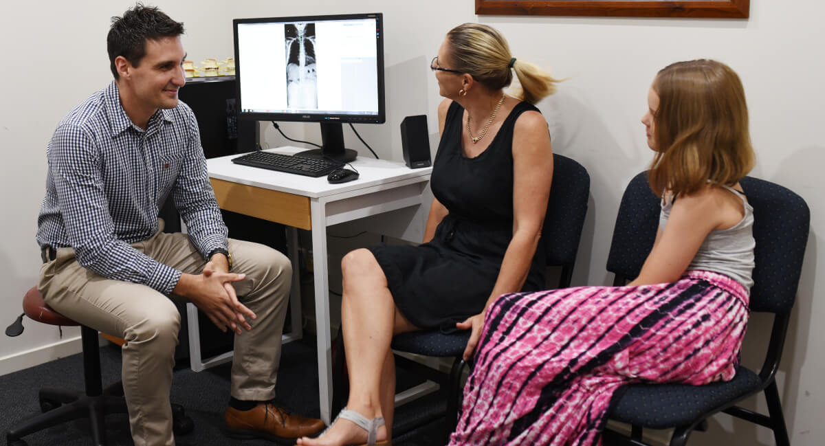 Dr Stott in consultation with patients