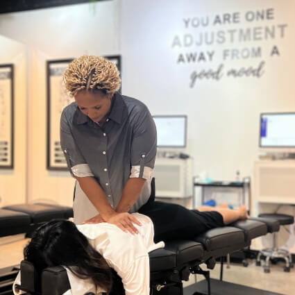 Lion City Chiropractic Chiropractor adjusting patient