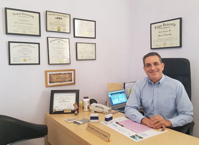 Dr. Gerry Nastasia at his desk