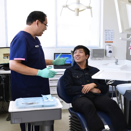 dentist talking with patient