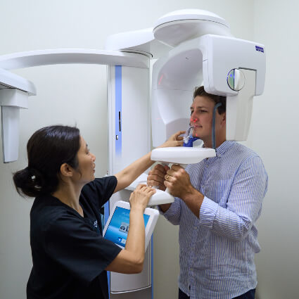Paddington Dentist Dr Christina setting up dental scanner