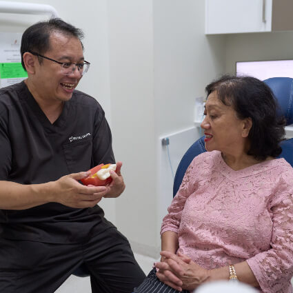 Paddington Dentist Dr Henry talkig to patient