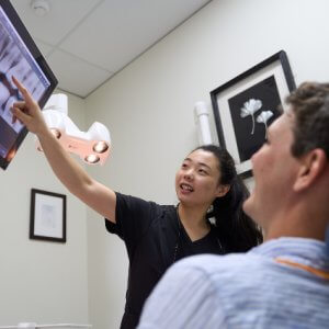 dr-ying-explaining-dental-scan-results