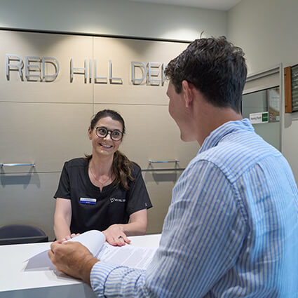 Receptionist helping patient