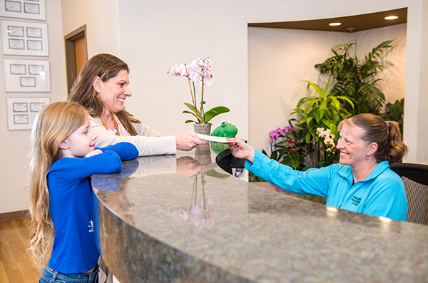 patients at reception desk