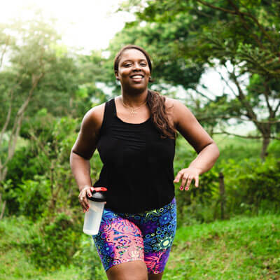 woman jogging in the forest