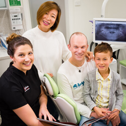 Oral health therapist and family of patients